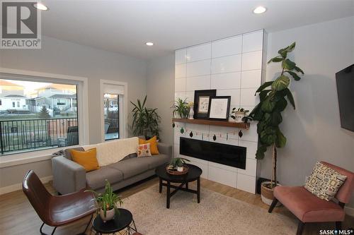 671 Fast Crescent, Saskatoon, SK - Indoor Photo Showing Living Room With Fireplace