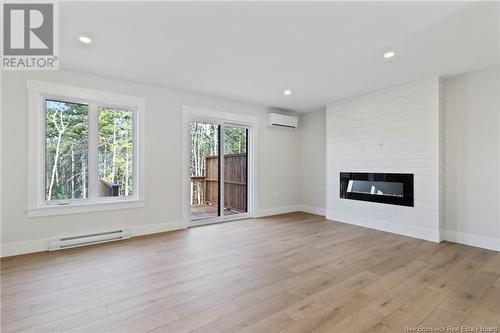 130 Elsliger Street, Dieppe, NB - Indoor Photo Showing Living Room With Fireplace