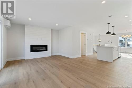 130 Elsliger Street, Dieppe, NB - Indoor Photo Showing Other Room With Fireplace