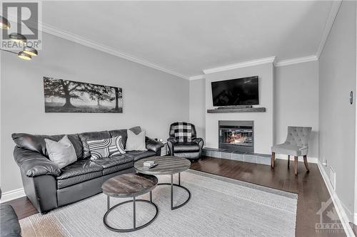 1441 Talcy Crescent, Ottawa, ON - Indoor Photo Showing Living Room With Fireplace