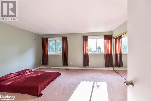 Carpeted bedroom with multiple windows - 441 Barrie Road Unit# 34, Orillia, ON - Indoor Photo Showing Other Room