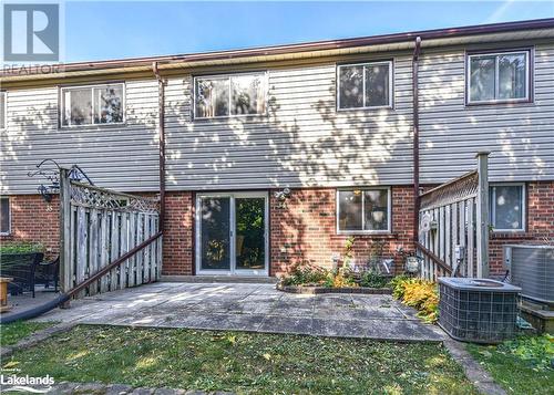 Back of property featuring central AC unit and a patio area - 441 Barrie Road Unit# 34, Orillia, ON - Outdoor