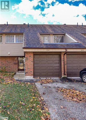 View of front of house with a garage - 441 Barrie Road Unit# 34, Orillia, ON - Outdoor