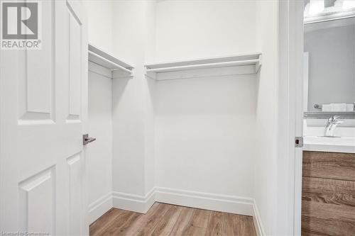 Spacious closet featuring sink and light hardwood / wood-style floors - 130 Livingston Avenue Unit# 21, Grimsby, ON - Indoor