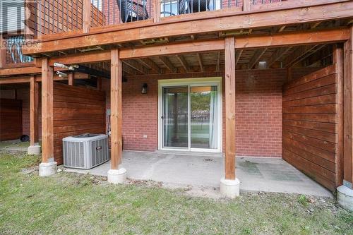 View of patio featuring a wooden deck and central AC - 130 Livingston Avenue Unit# 21, Grimsby, ON - Outdoor With Deck Patio Veranda With Exterior