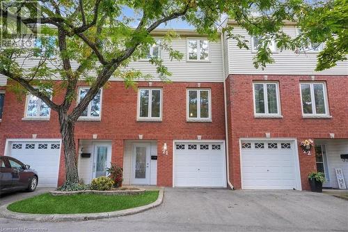 Townhome / multi-family property with a garage - 130 Livingston Avenue Unit# 21, Grimsby, ON - Outdoor With Facade