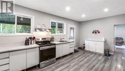 Updated and modern eat-in kitchen. - 