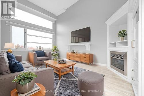 403 - 50 Main Street, Hamilton, ON - Indoor Photo Showing Living Room With Fireplace