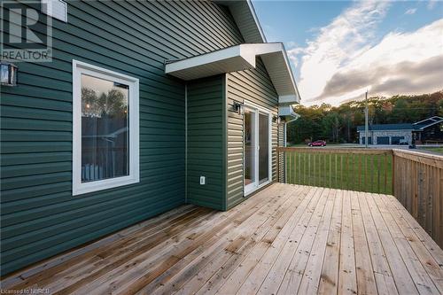 large deck off the kitchen perfect for grilling and entertaining - 46 Oakridge Estates, Corbeil, ON - Outdoor With Deck Patio Veranda With Exterior