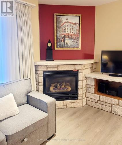 2134 - 90 Highland Drive, Oro-Medonte, ON - Indoor Photo Showing Living Room With Fireplace