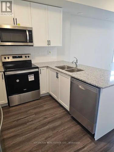 124 - 1573 Rose Way, Milton, ON - Indoor Photo Showing Kitchen With Stainless Steel Kitchen With Double Sink