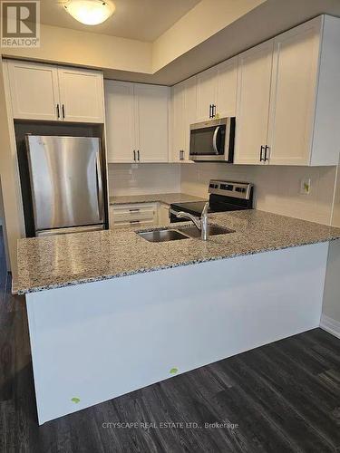 124 - 1573 Rose Way, Milton, ON - Indoor Photo Showing Kitchen With Stainless Steel Kitchen With Double Sink