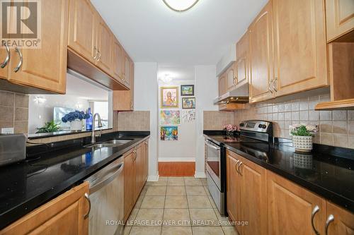 304 - 25 Trailwood Drive, Mississauga, ON - Indoor Photo Showing Kitchen With Double Sink