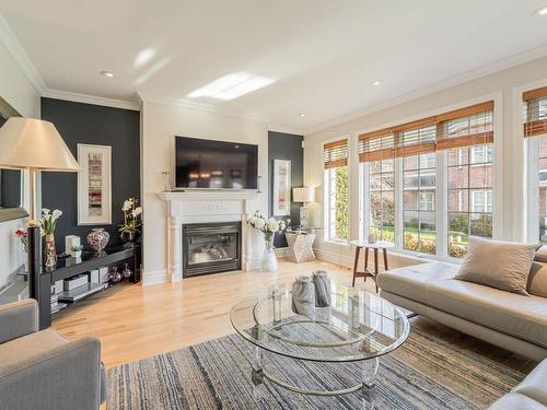 Living room - 371 Rue De L'Harmonie, Laval (Duvernay), QC - Indoor Photo Showing Living Room With Fireplace