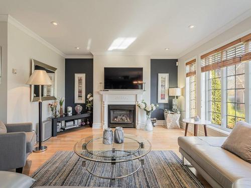 Living room - 371 Rue De L'Harmonie, Laval (Duvernay), QC - Indoor Photo Showing Living Room With Fireplace