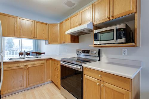 115-133 Wyndham Crescent, Kelowna, BC - Indoor Photo Showing Kitchen With Double Sink