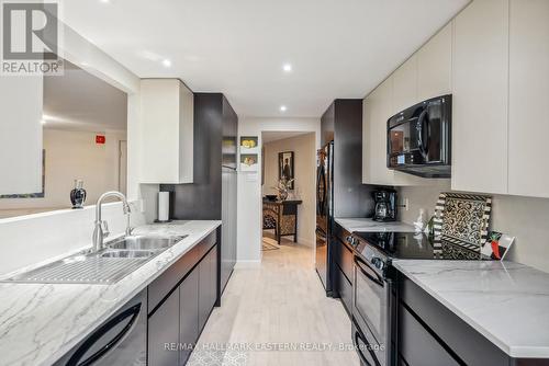 502 - 2 George Street N, Peterborough (Downtown), ON - Indoor Photo Showing Kitchen With Double Sink