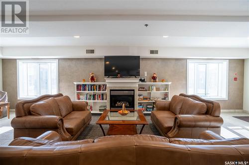 306 2909 Arens Road E, Regina, SK - Indoor Photo Showing Living Room With Fireplace