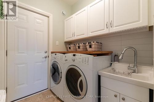 Main Floor Laundry - 377 Darcy Drive S, Strathroy-Caradoc (Ne), ON - Indoor Photo Showing Laundry Room