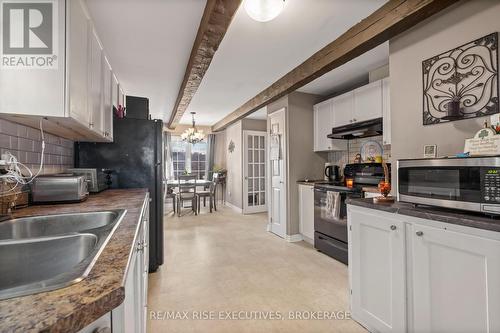 311 Simmons Road, Loyalist (Lennox And Addington - South), ON - Indoor Photo Showing Kitchen With Double Sink