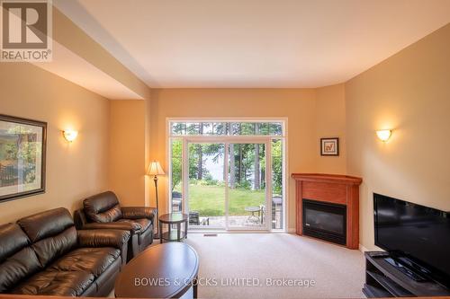 7 - 1579 Anstruther Lake Road, North Kawartha, ON - Indoor Photo Showing Living Room With Fireplace