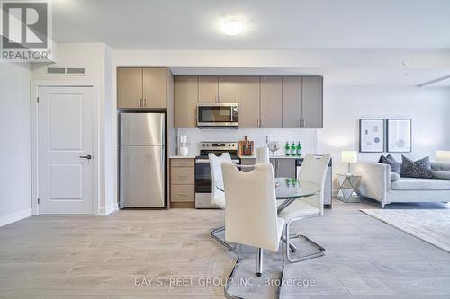 813 - 3200 William Coltson Avenue, Oakville, ON - Indoor Photo Showing Kitchen With Stainless Steel Kitchen