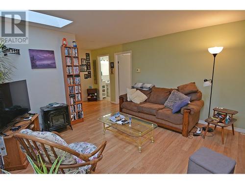 705 Giffin Avenue, Slocan, BC - Indoor Photo Showing Living Room With Fireplace