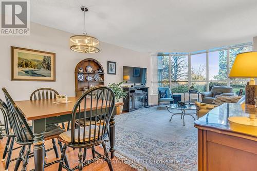 107 - 20 Guildwood Parkway, Toronto, ON - Indoor Photo Showing Dining Room With Fireplace