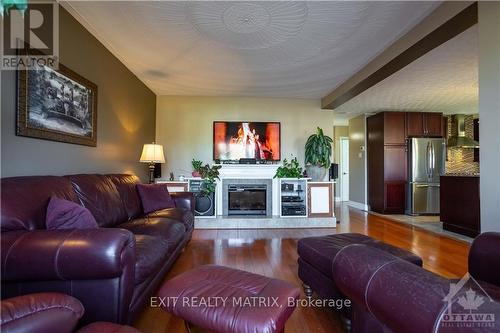 828 Notre Dame Street, Russell, ON - Indoor Photo Showing Living Room With Fireplace