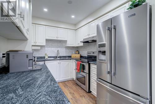 19 - 2880 Headon Forest Drive, Burlington, ON - Indoor Photo Showing Kitchen With Double Sink