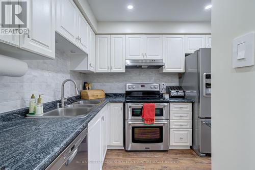 19 - 2880 Headon Forest Drive, Burlington, ON - Indoor Photo Showing Kitchen With Double Sink