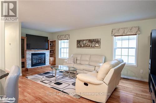 13 Marvin Gardens Boulevard, Wasaga Beach, ON - Indoor Photo Showing Living Room With Fireplace