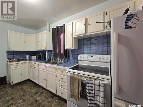 1411 110Th Street, North Battleford, SK - Indoor Photo Showing Kitchen With Double Sink