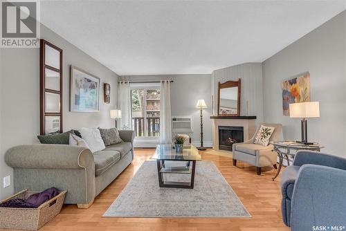 102B 1121 Mckercher Drive, Saskatoon, SK - Indoor Photo Showing Living Room With Fireplace