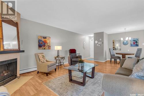 102B 1121 Mckercher Drive, Saskatoon, SK - Indoor Photo Showing Living Room With Fireplace