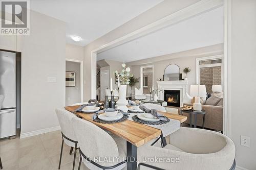 46 Broome Avenue, Clarington (Courtice), ON - Indoor Photo Showing Dining Room With Fireplace