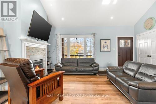 96 Huyck'S Bay Road, Prince Edward County (Wellington), ON - Indoor Photo Showing Living Room With Fireplace