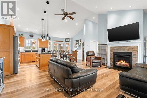 96 Huyck'S Bay Road, Prince Edward County (Wellington), ON - Indoor Photo Showing Living Room With Fireplace