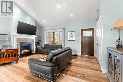 96 Huyck'S Bay Road, Prince Edward County (Wellington), ON - Indoor Photo Showing Living Room With Fireplace