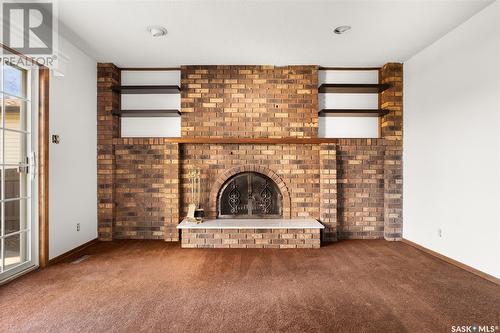 66 Houston Road, Regina, SK - Indoor Photo Showing Other Room With Fireplace