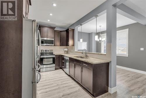 430 Langer Place, Warman, SK - Indoor Photo Showing Kitchen With Double Sink