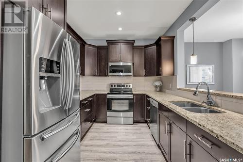 430 Langer Place, Warman, SK - Indoor Photo Showing Kitchen With Stainless Steel Kitchen With Double Sink With Upgraded Kitchen