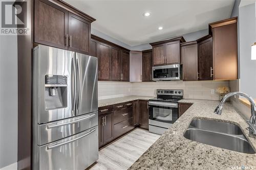 430 Langer Place, Warman, SK - Indoor Photo Showing Kitchen With Stainless Steel Kitchen With Double Sink