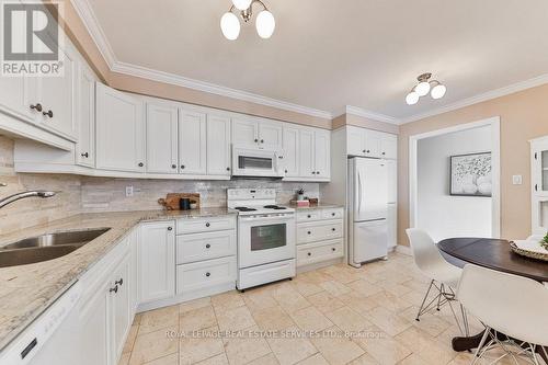 301 - 2175 Marine Drive, Oakville, ON - Indoor Photo Showing Kitchen With Double Sink