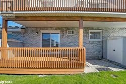 Wooden terrace featuring a shed - 