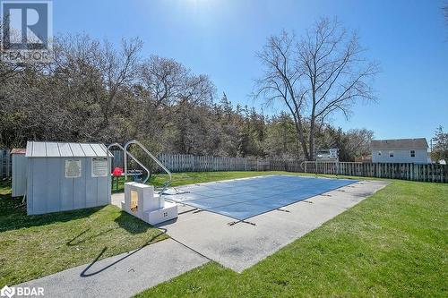 View of pool with a storage unit, a yard, and a patio area - 73 Lywood Street Unit# 2, Belleville, ON - Outdoor With Backyard