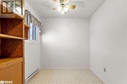 Spare room with a baseboard heating unit, a textured ceiling, and ceiling fan - 