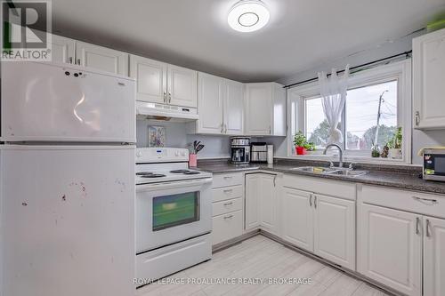 10-12 Manitou Crescent E, Loyalist (Amherstview), ON - Indoor Photo Showing Kitchen With Double Sink