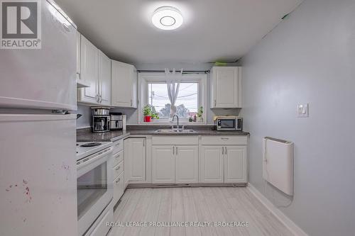 10-12 Manitou Crescent E, Loyalist (Amherstview), ON - Indoor Photo Showing Kitchen With Double Sink