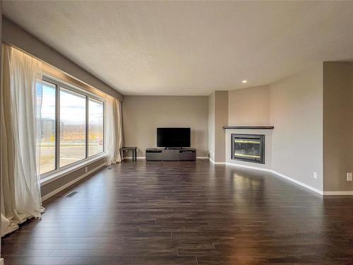 7 3350 Mcdonald Avenue, Brandon, MB - Indoor Photo Showing Living Room With Fireplace